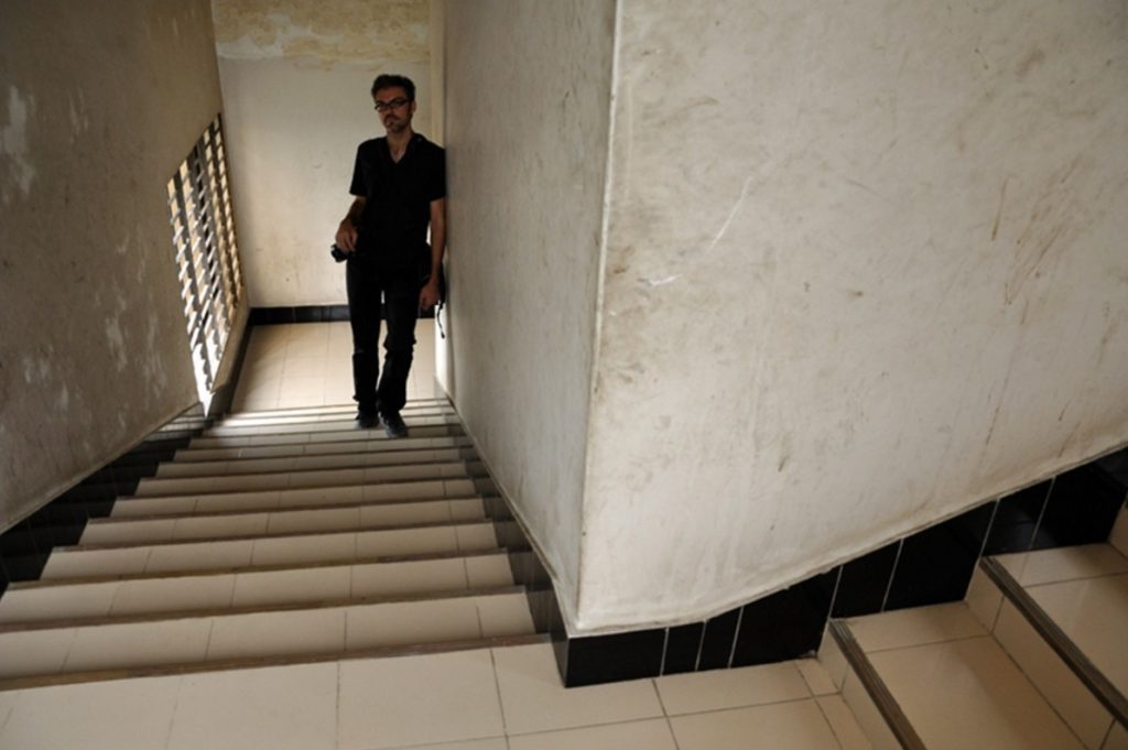 Photographer Lenny Plotkin in a stairwell in Faridpur, Bangladesh