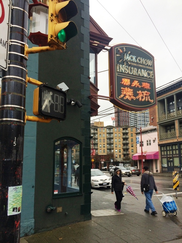 The Jack Chow sign is wider than the building; the width of the structure is the darker shade of paint.