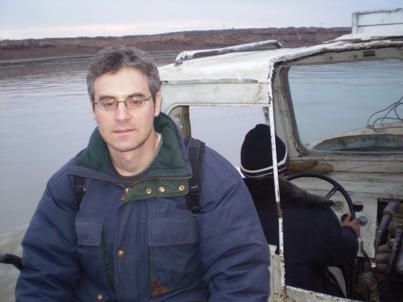 Larry Schwarz on the boat over the Panj River from Tajikistan to Afghanistan